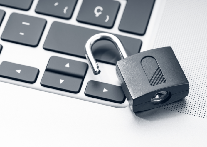 Open Padlock on Laptop Keyboard